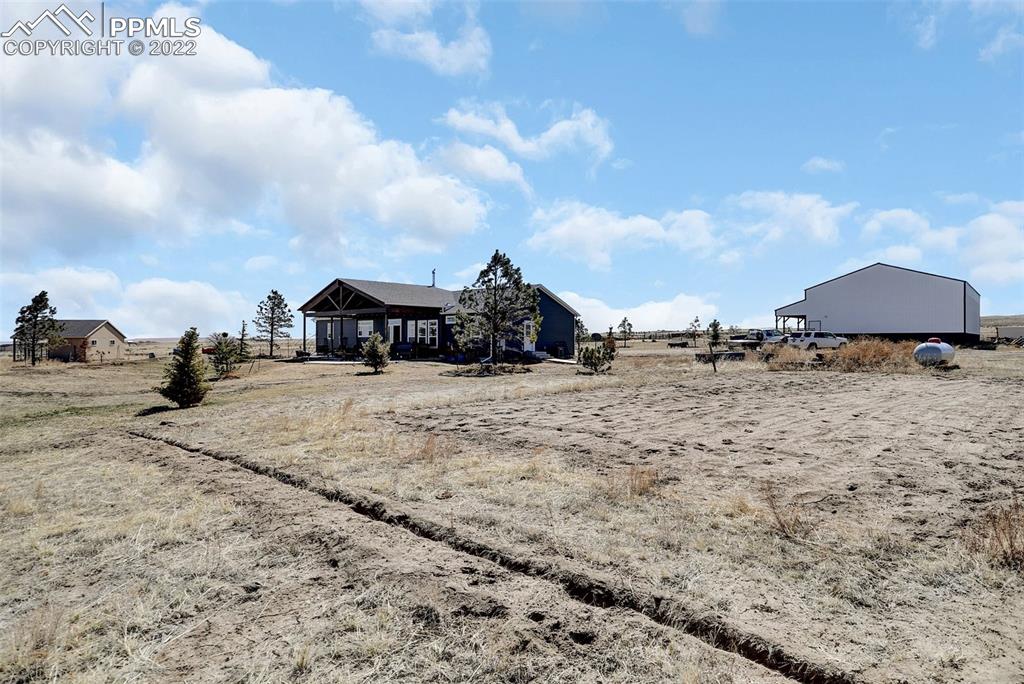 24335 Sweet Road Calhan, CO 80808 - Photo 2 of 39 a view of houses with outdoor space