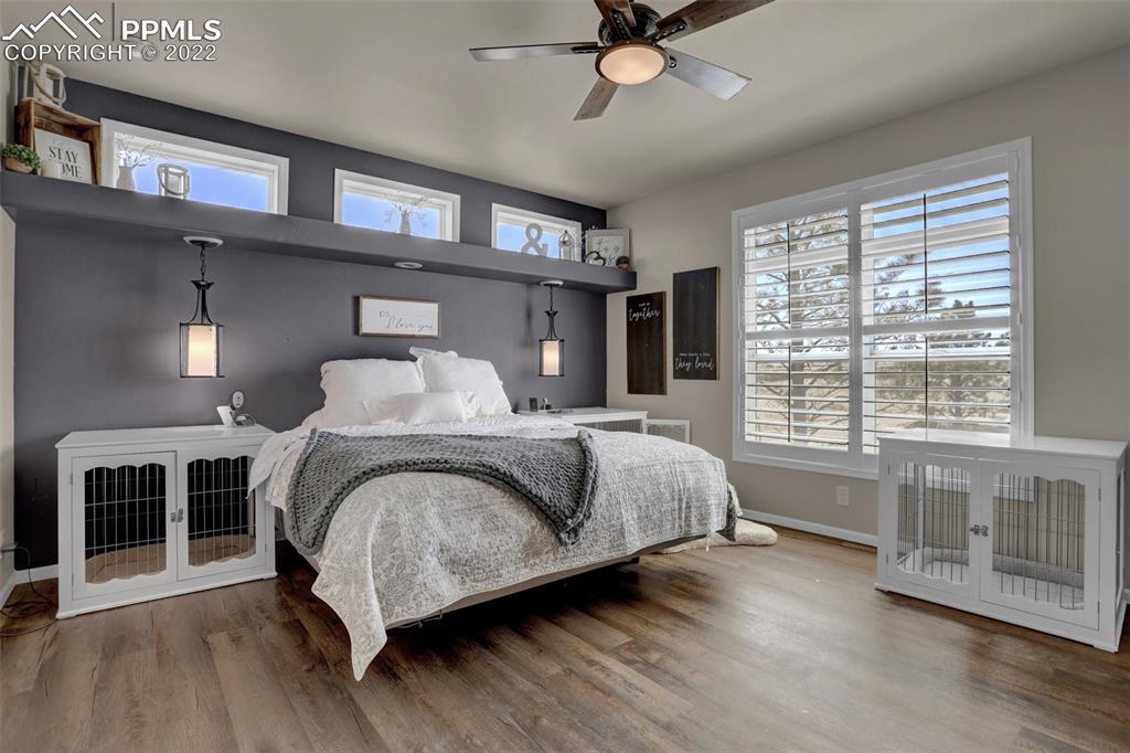 24335 Sweet Road Calhan, CO 80808 - Photo 24 of 39 a bedroom with a large bed and a large window