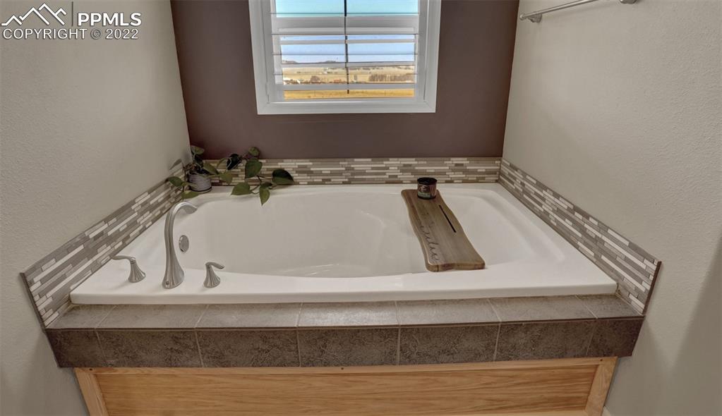 24335 Sweet Road Calhan, CO 80808 - Photo 28 of 39 a bathroom with a granite countertop sink