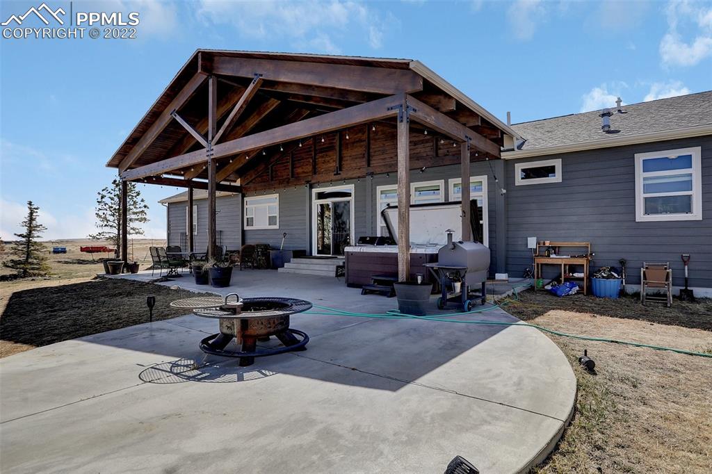 24335 Sweet Road Calhan, CO 80808 - Photo 30 of 39 a view of a patio with table and chairs