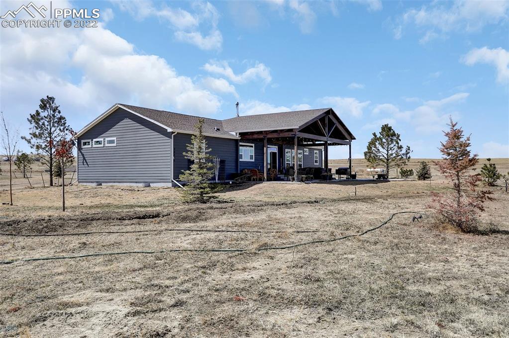 24335 Sweet Road Calhan, CO 80808 - Photo 31 of 39 a front view of a house with a yard
