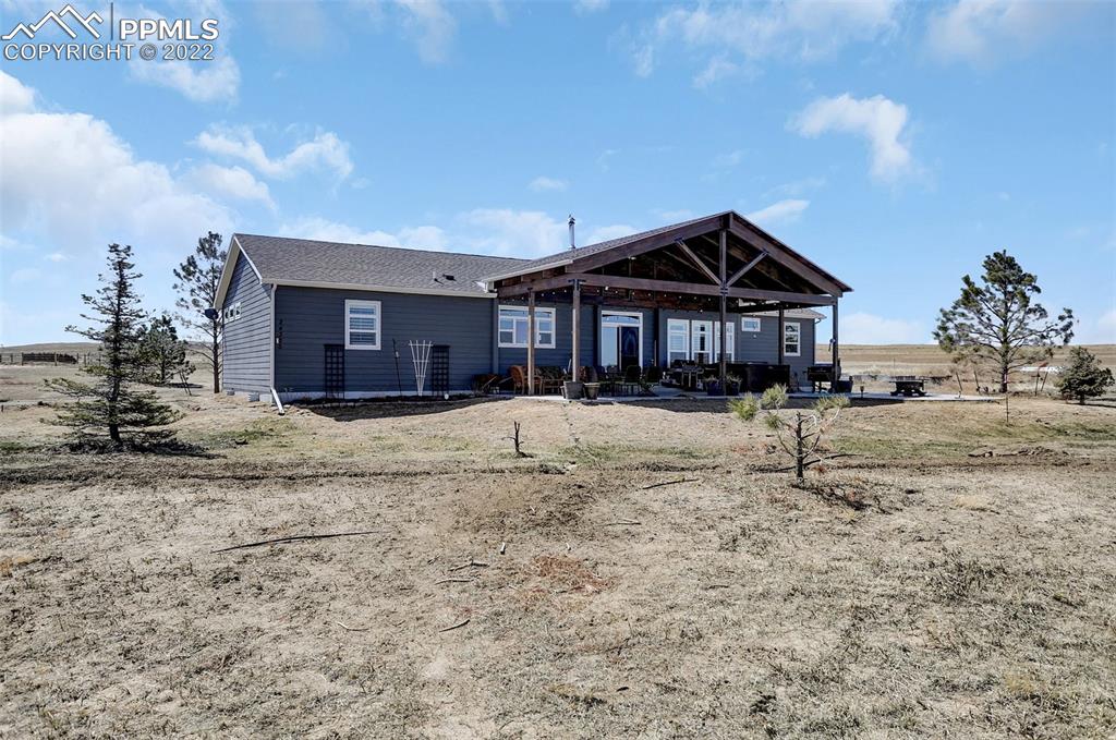 24335 Sweet Road Calhan, CO 80808 - Photo 32 of 39 a front view of a house with a yard
