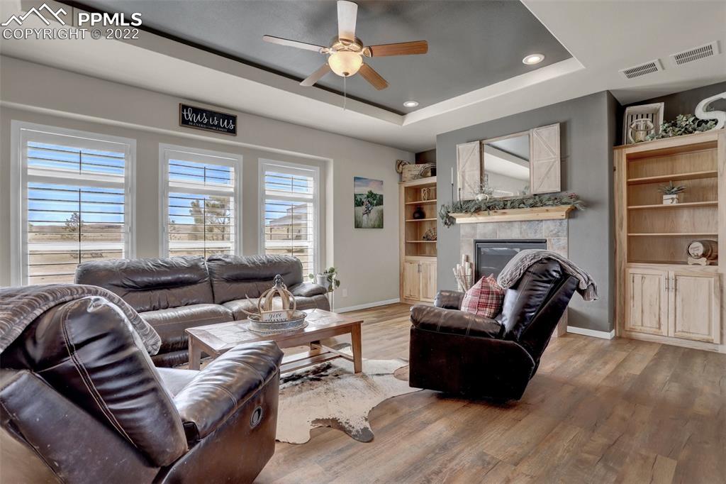 24335 Sweet Road Calhan, CO 80808 - Photo 5 of 39 a living room with furniture fireplace and a window