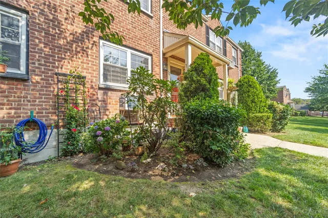 a small garden in the backyard of a house