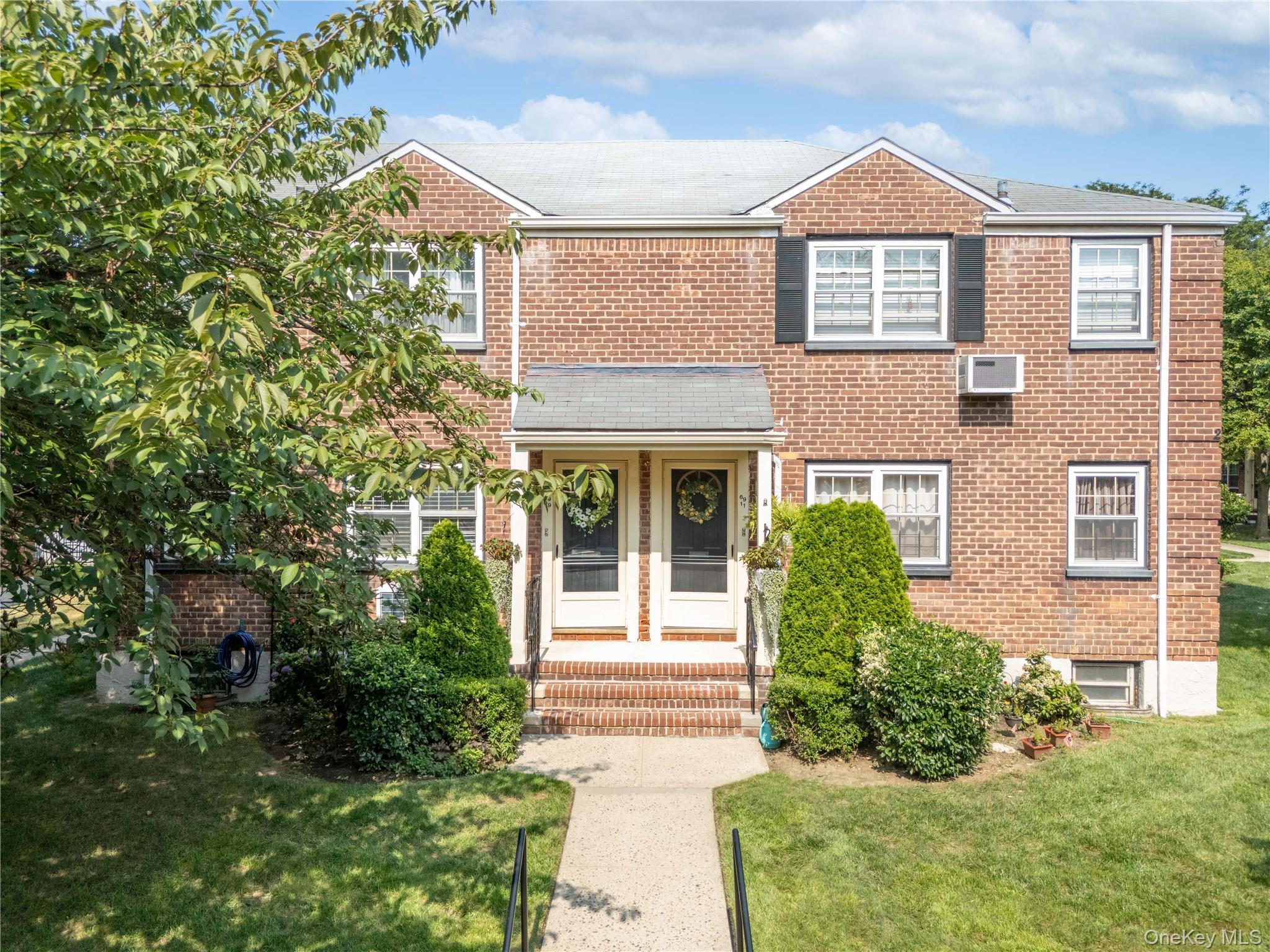 69-09 215th Street, Unit LOWER 1 Queens, NY 11364 - Photo 17 of 20 Traditional home with a front yard and brick siding