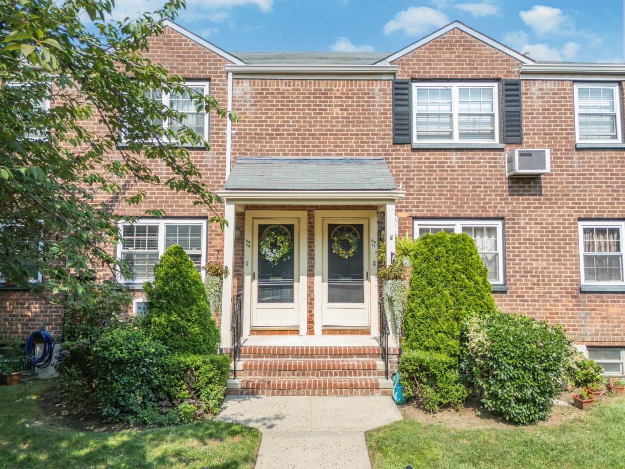 69-09 215th Street, Unit LOWER 1 Queens, NY 11364 - Photo 19 of 20 front view of a house with a yard