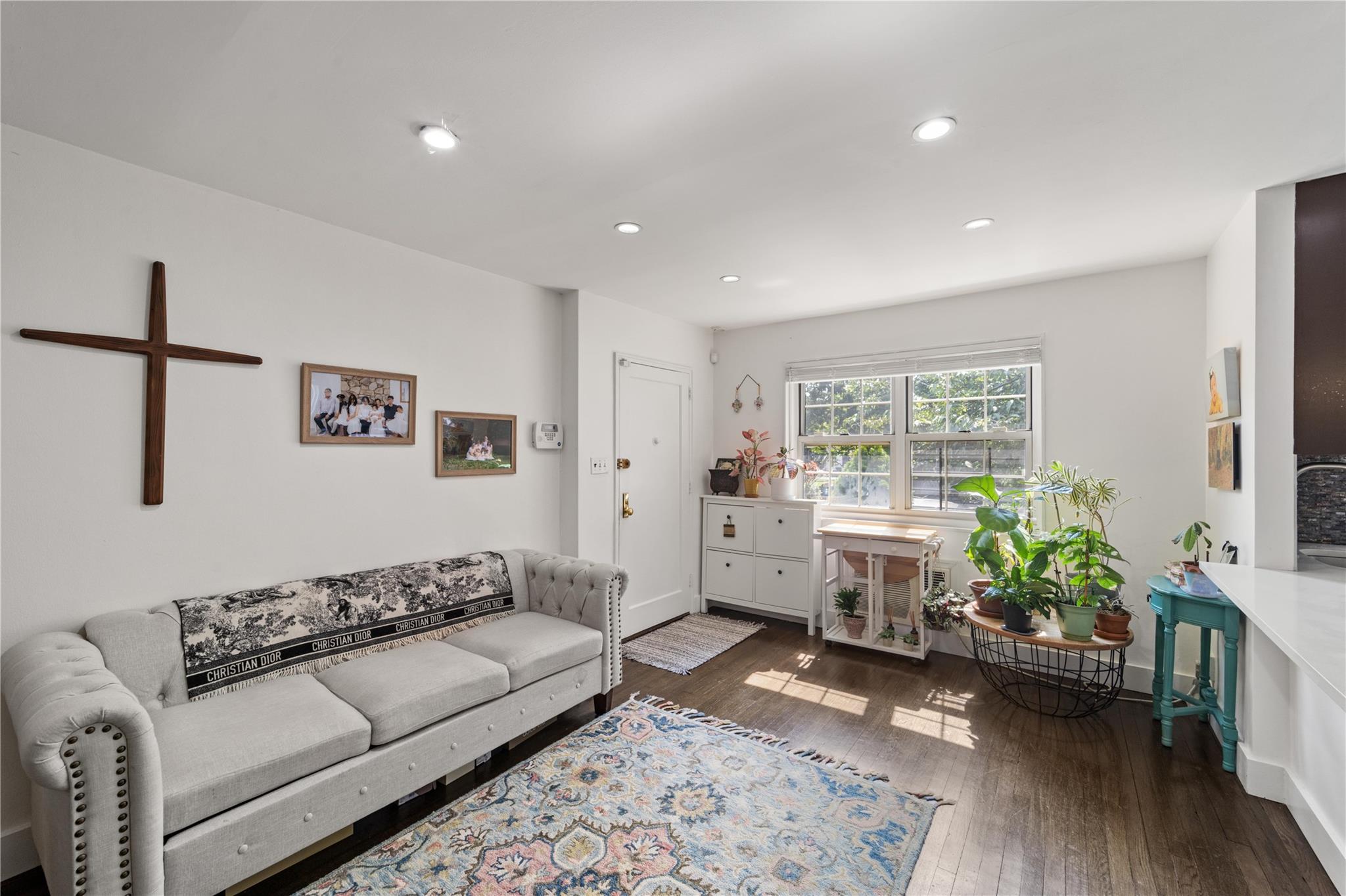 69-09 215th Street, Unit LOWER 1 Queens, NY 11364 - Photo 2 of 20 a living room with furniture and wooden floor