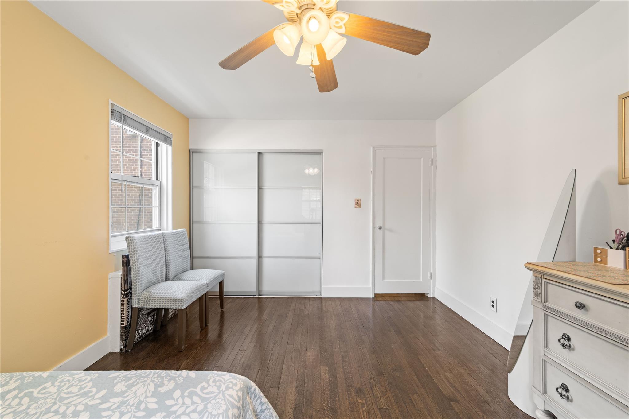 69-09 215th Street, Unit LOWER 1 Queens, NY 11364 - Photo 7 of 20 a living room with furniture and a window