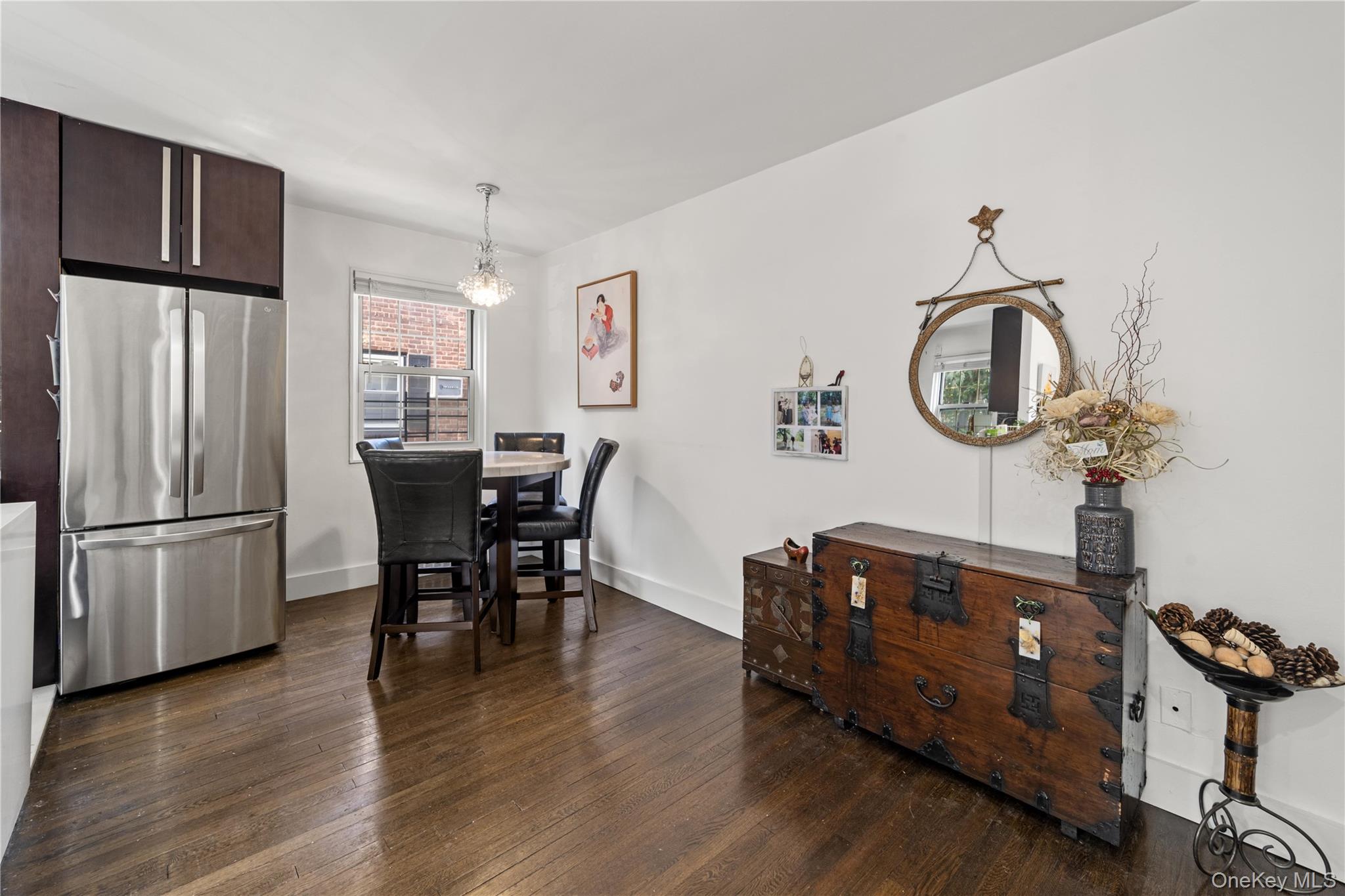 69-09 215th Street, Unit LOWER 1 Queens, NY 11364 - Photo 8 of 20 Dining area featuring dark wood-type flooring and a chandelier