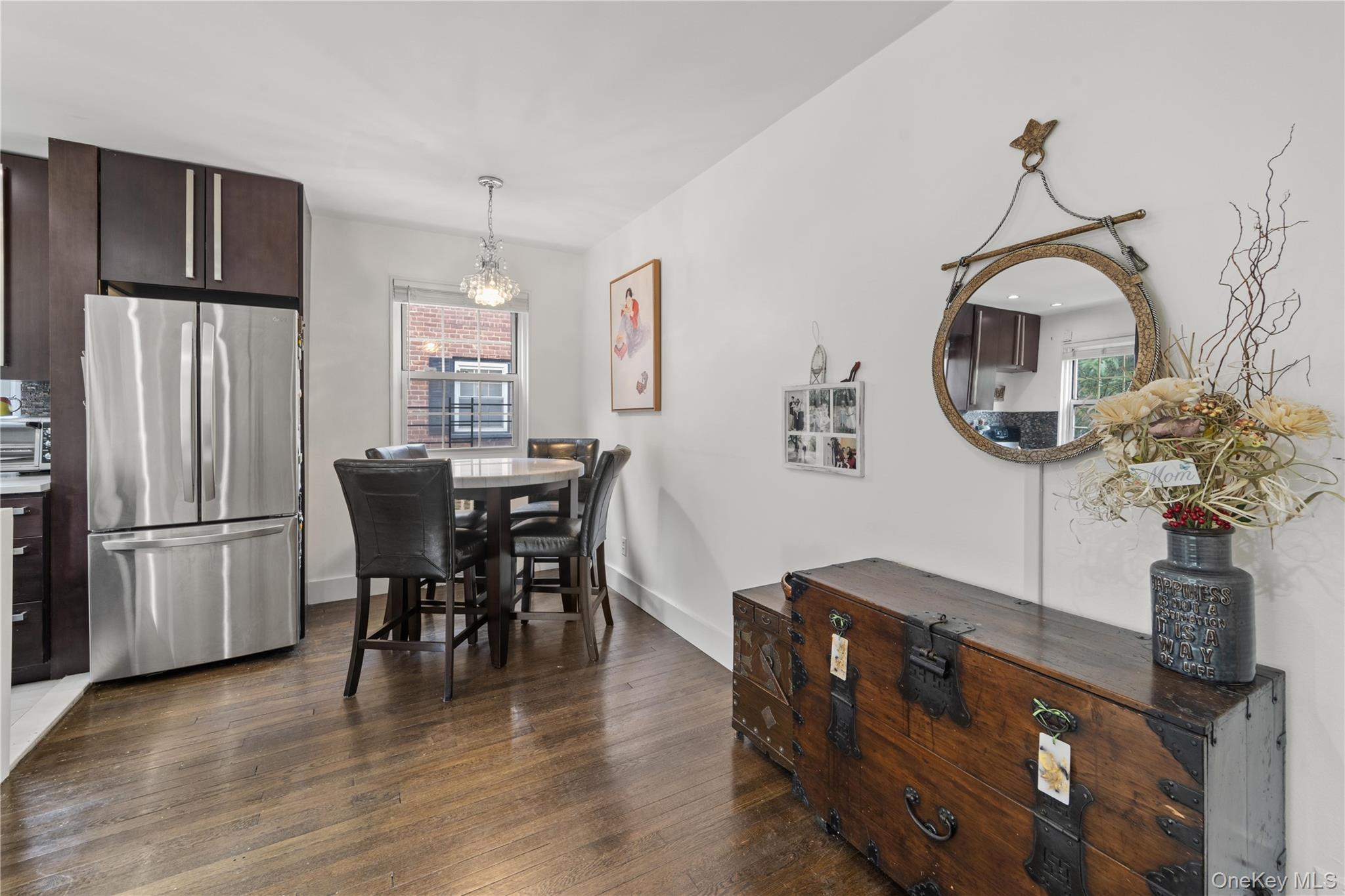 69-09 215th Street, Unit LOWER 1 Queens, NY 11364 - Photo 9 of 20 Dining room featuring dark wood-type flooring and a chandelier