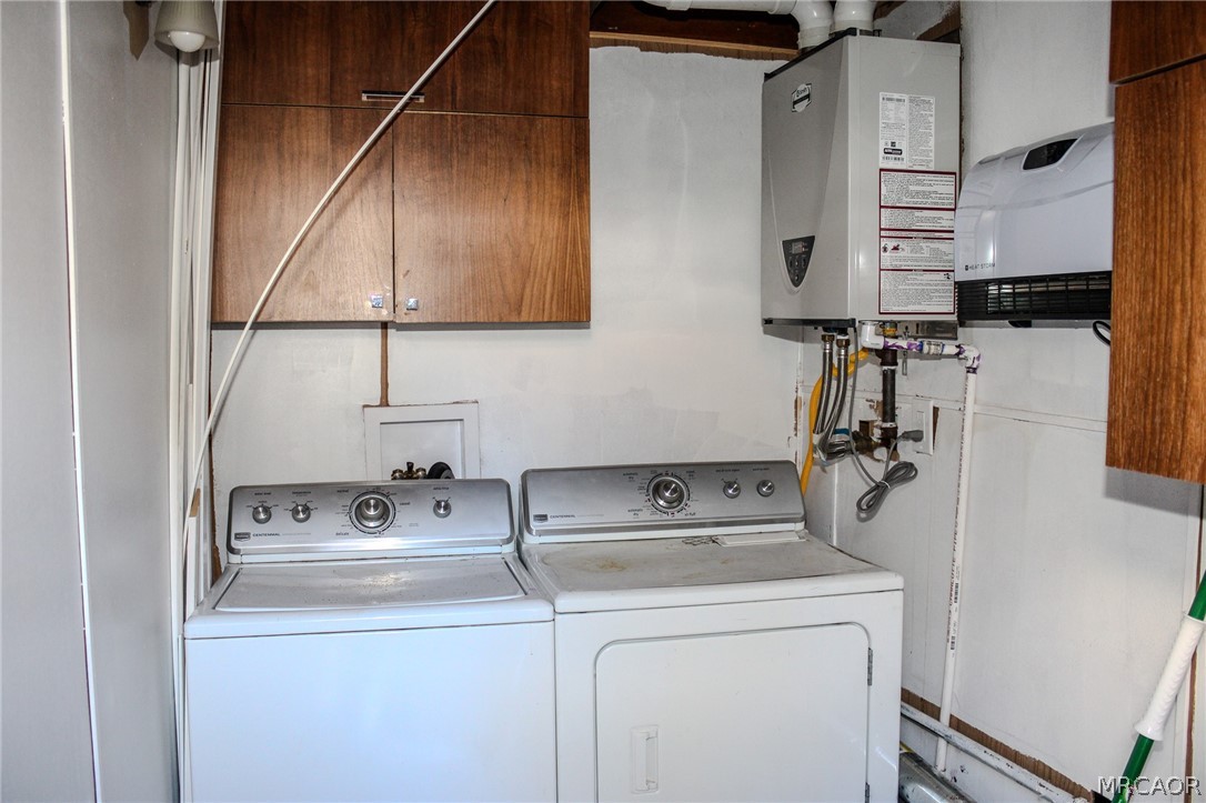 42830 Cougar Road, Unit UPPR Big Bear Lake, CA 92315 - Photo 18 of 21 a bathroom with a sink and a washer dryer