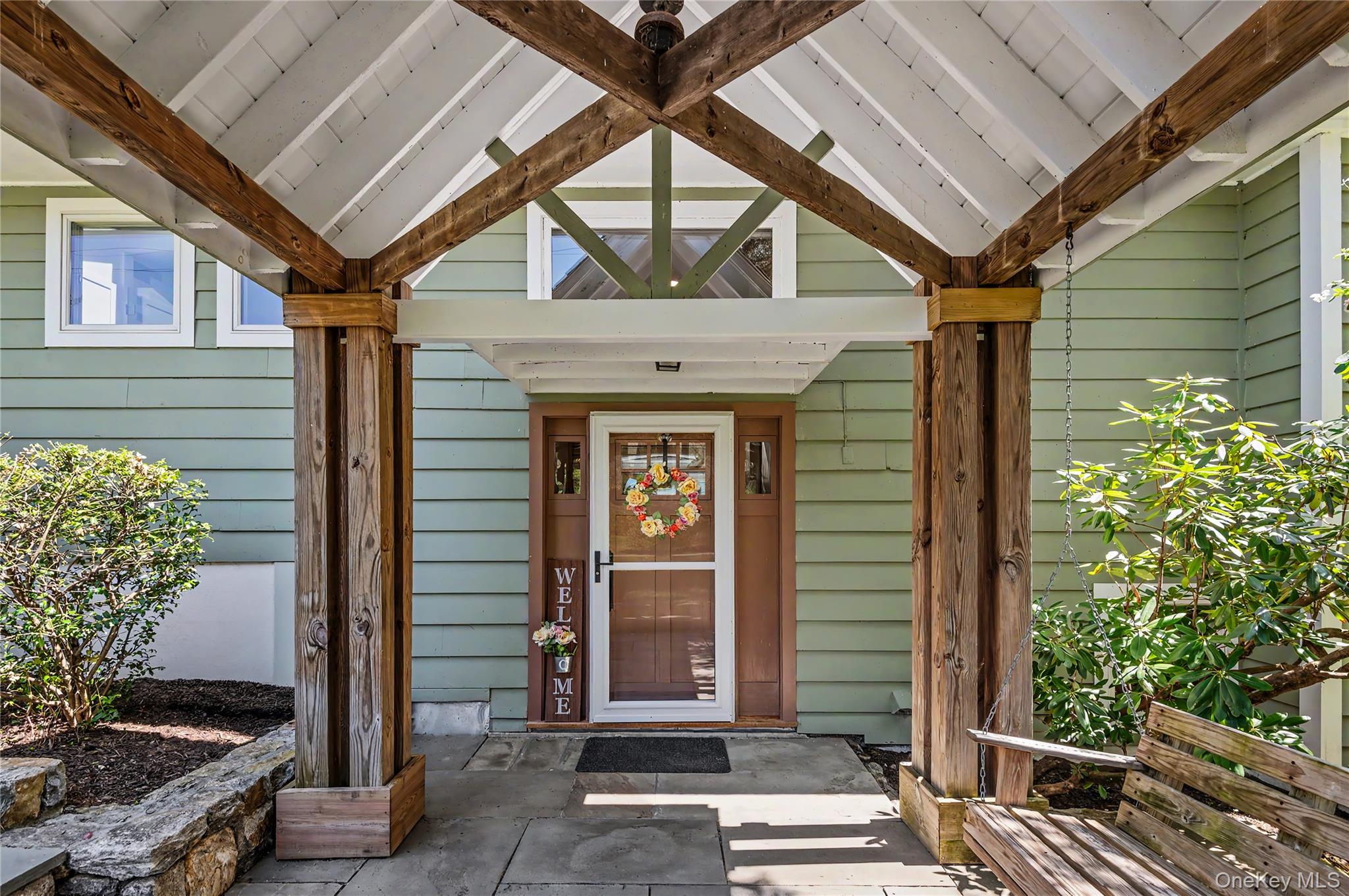 41 Cross Pond Road Pound Ridge, NY 10576 - Photo 2 of 41 a front view of a house with a garden