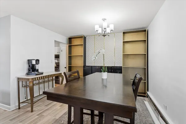 a view of a dining room with furniture and wooden floor