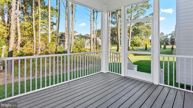 a view of a balcony with wooden floor