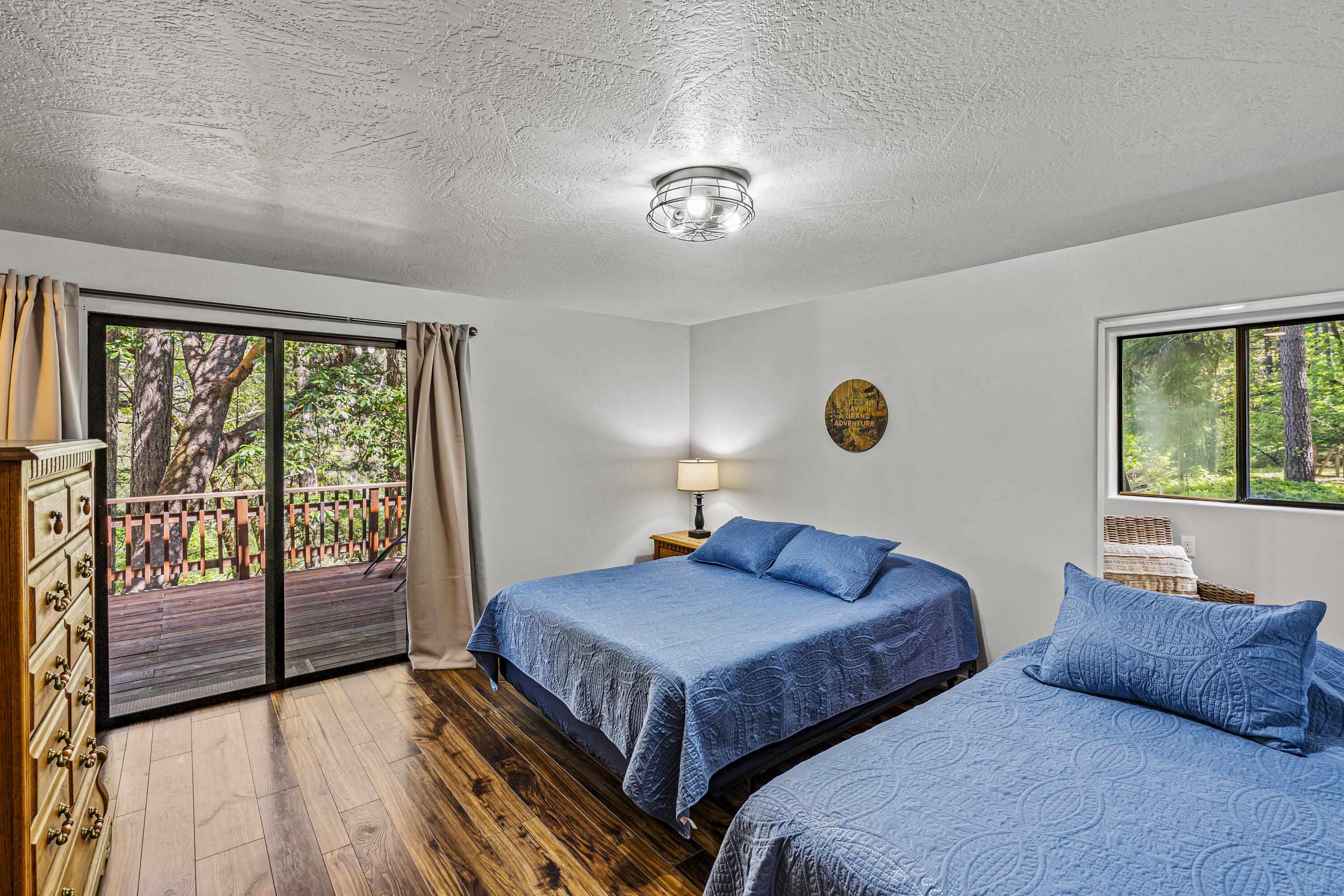 11744 Galice Road Merlin, OR 97532 - Photo 51 of 74 a bedroom with two beds and a large window