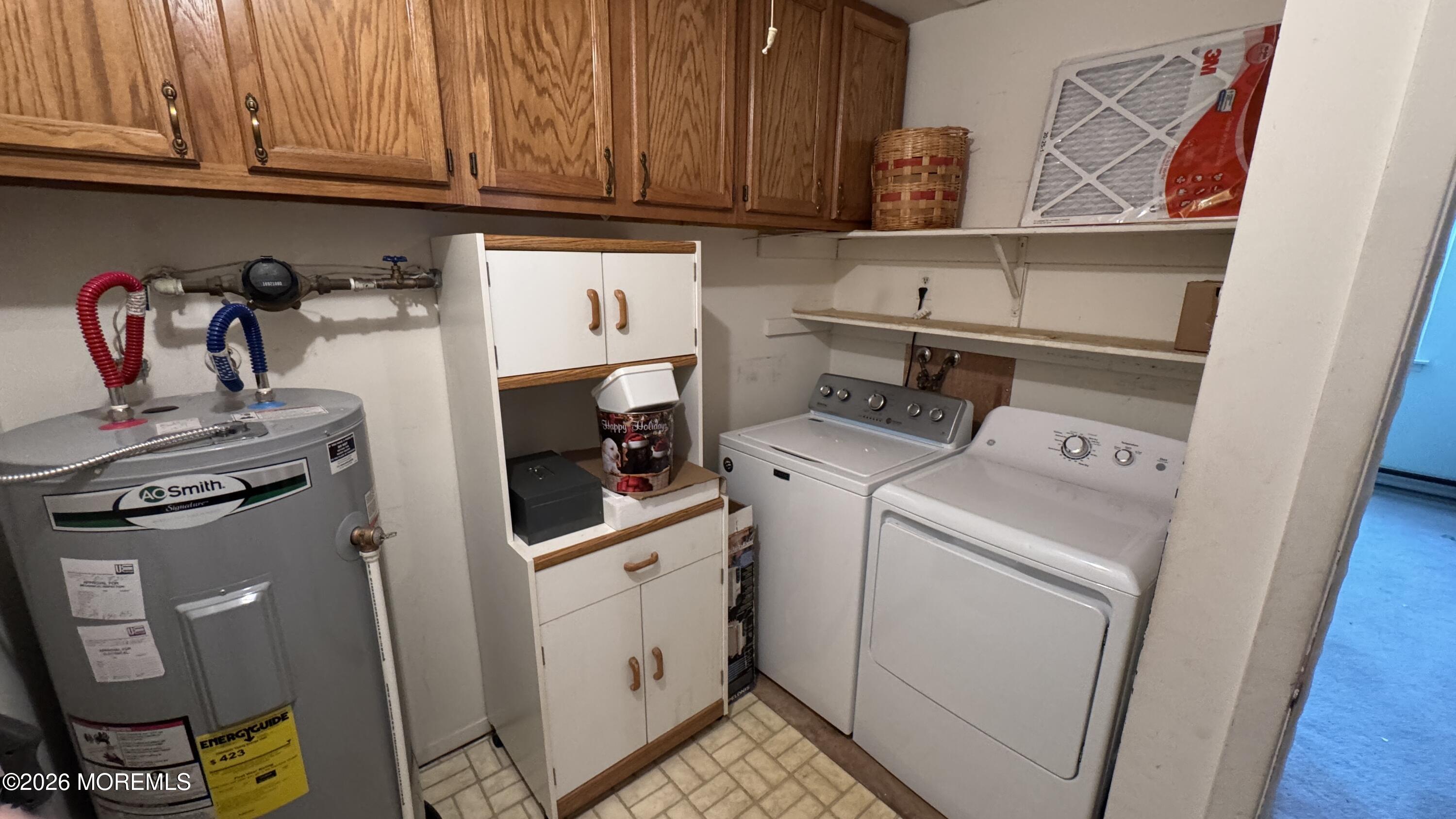 40A Stonybrook Road, Unit 62 Whiting, NJ 08759 - Photo 11 of 12 a utility room with dryer and washer