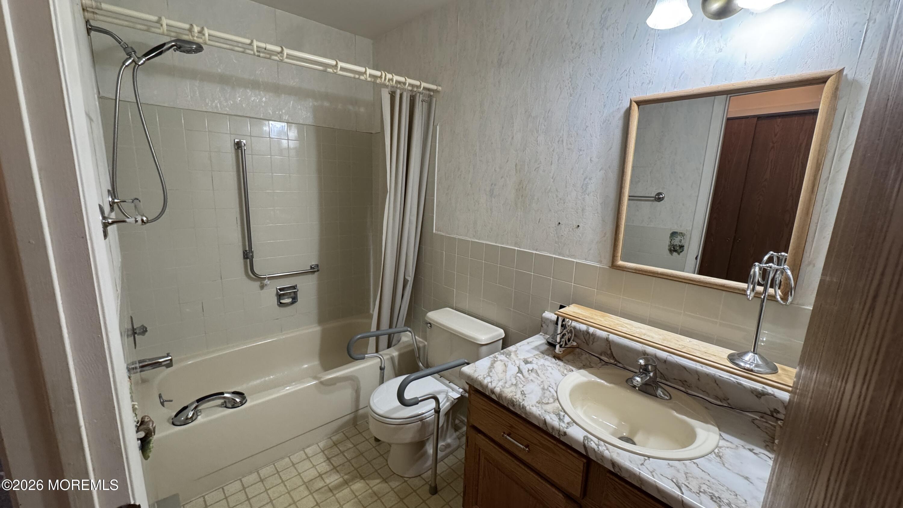 40A Stonybrook Road, Unit 62 Whiting, NJ 08759 - Photo 6 of 12 a bathroom with a granite countertop sink toilet mirror vanity and shower