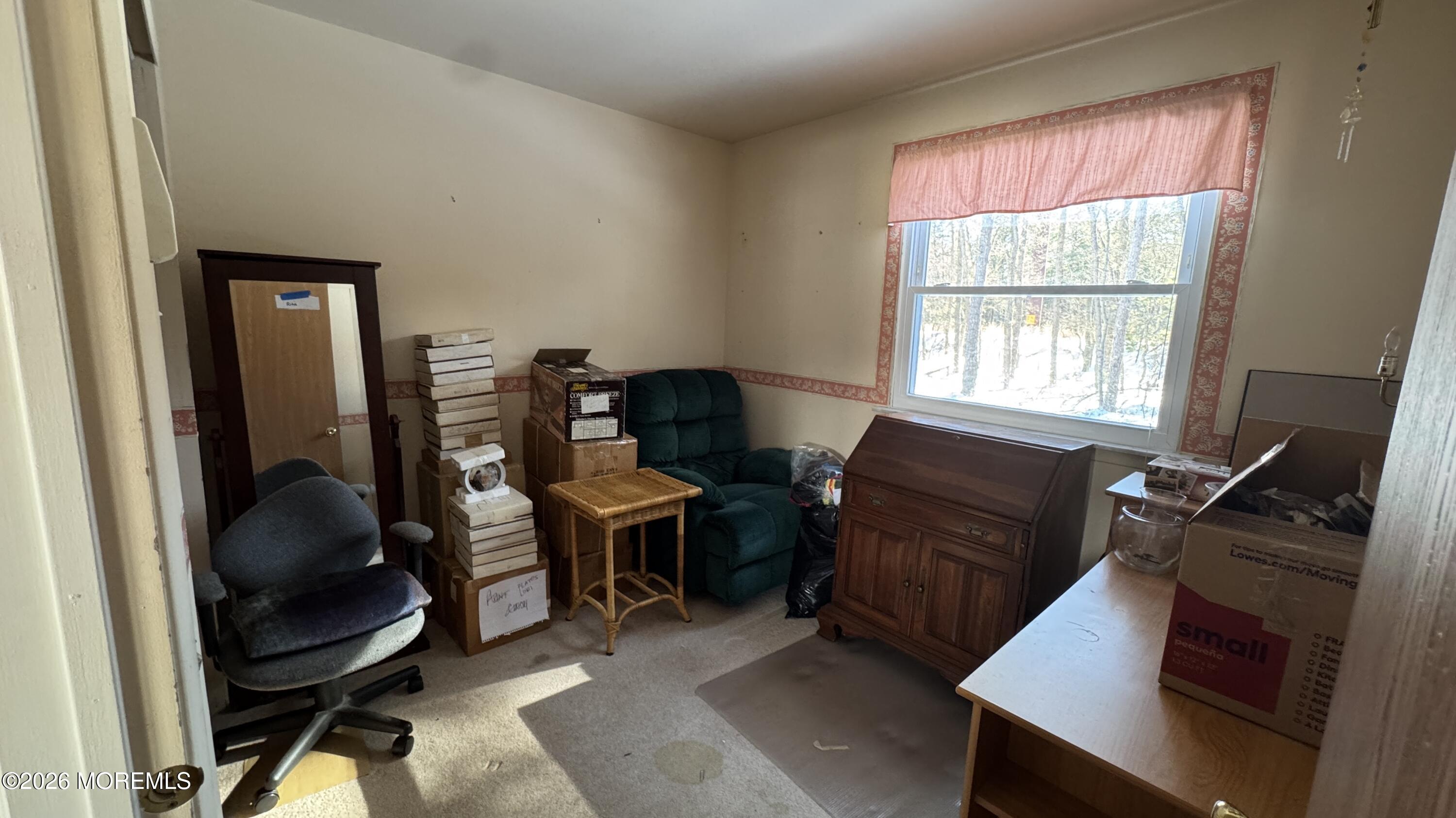 40A Stonybrook Road, Unit 62 Whiting, NJ 08759 - Photo 9 of 12 a view of a workspace with furniture and a window