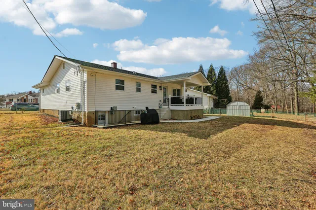 a balcony view with a couch and chairs