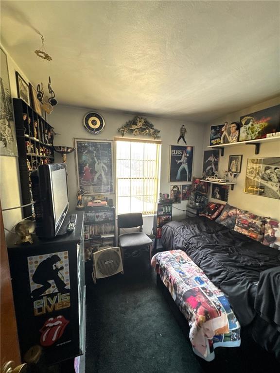 5366 Brownsville Road Pittsburgh, PA 15236 - Photo 15 of 20 a bedroom with furniture and a window