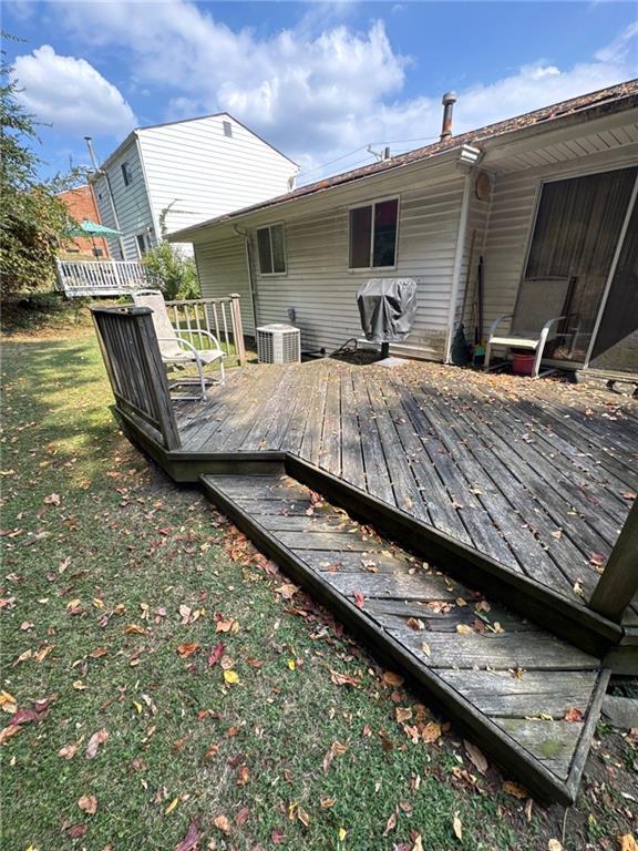 5366 Brownsville Road Pittsburgh, PA 15236 - Photo 4 of 20 a roof deck with table and chairs a barbeque