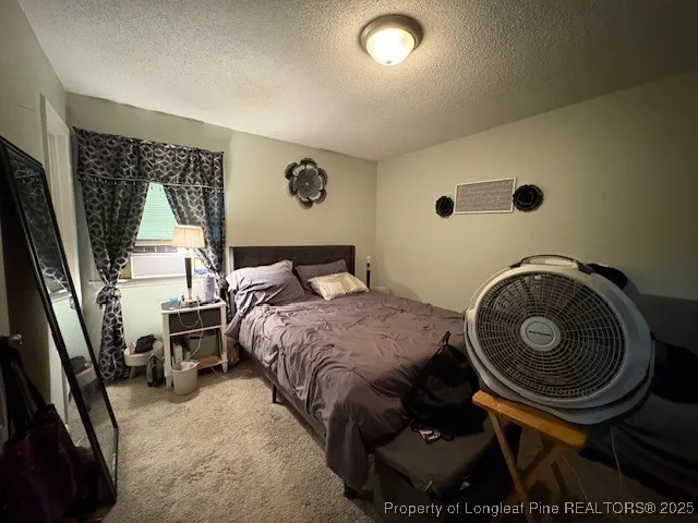 a bedroom with a bed and a closet in it