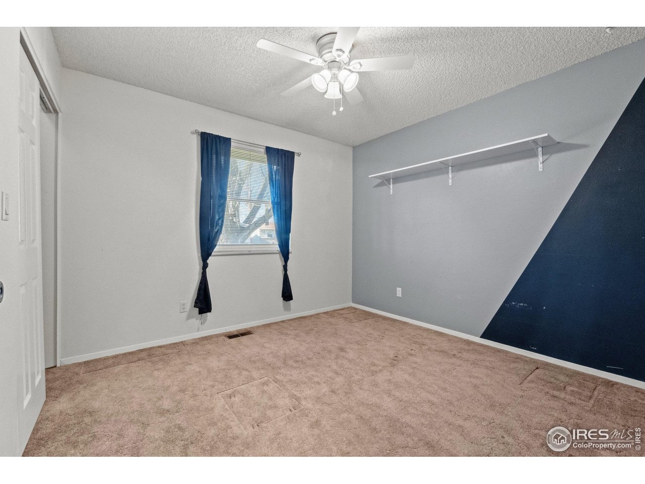 310 Apache Street Fort Morgan, CO 80701 - Photo 22 of 50 a view of an empty room with a window