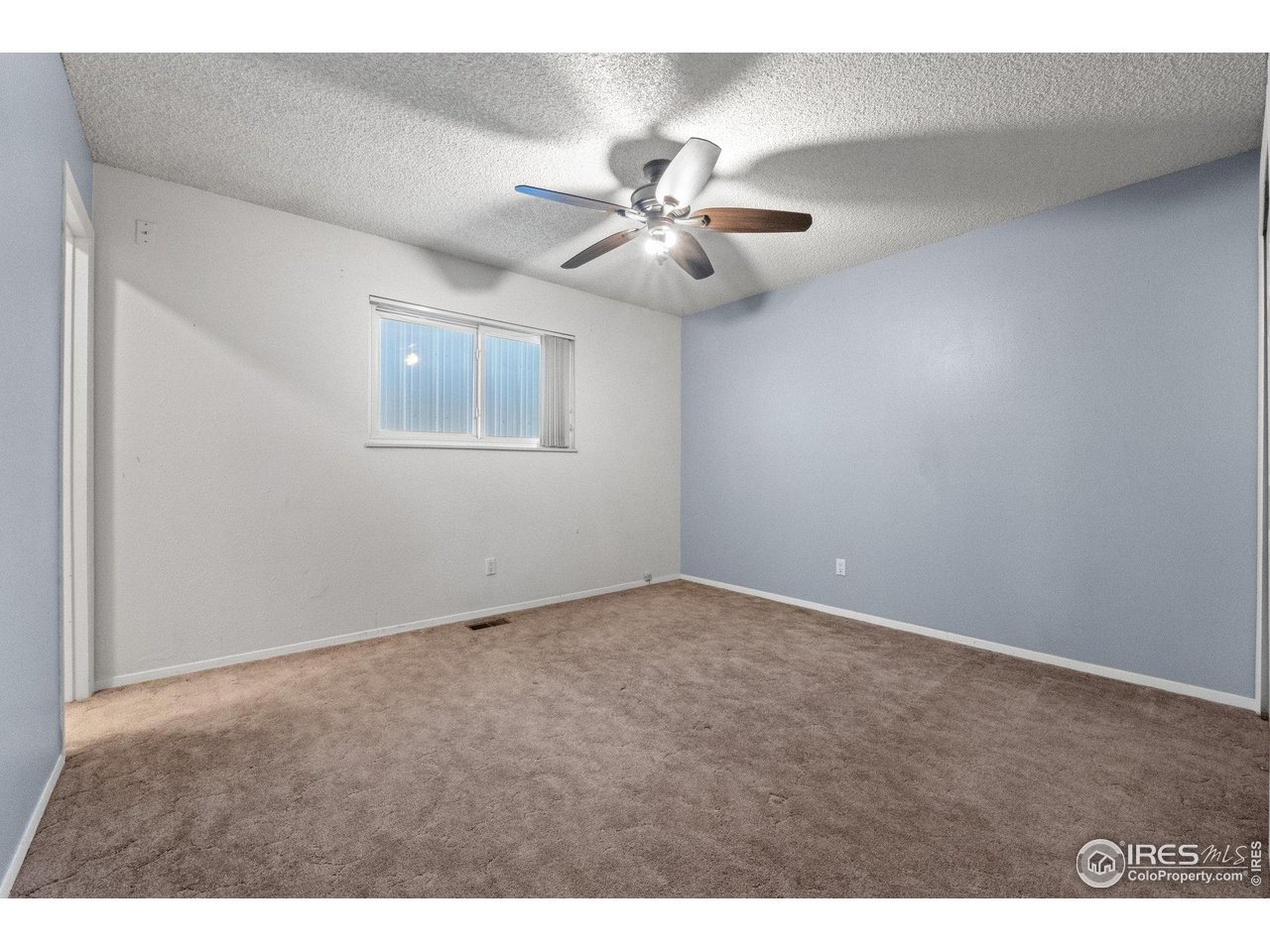 310 Apache Street Fort Morgan, CO 80701 - Photo 24 of 50 a view of an empty room with a fan