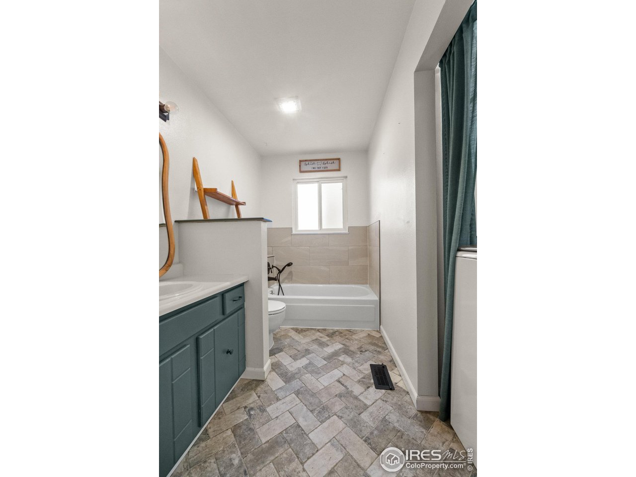 310 Apache Street Fort Morgan, CO 80701 - Photo 27 of 50 a bathroom with a sink and a bathtub