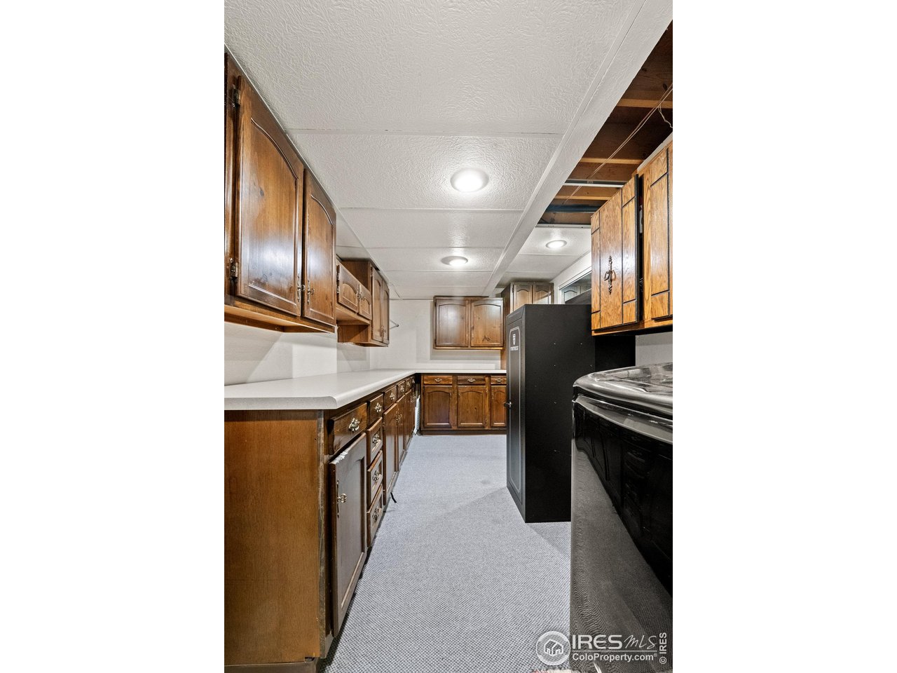 310 Apache Street Fort Morgan, CO 80701 - Photo 34 of 50 a kitchen with stainless steel appliances granite countertop a sink and a refrigerator