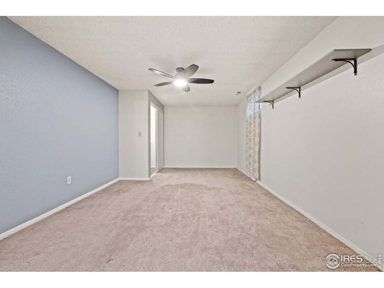 310 Apache Street Fort Morgan, CO 80701 - Photo 35 of 50 a view of a big room with carpet