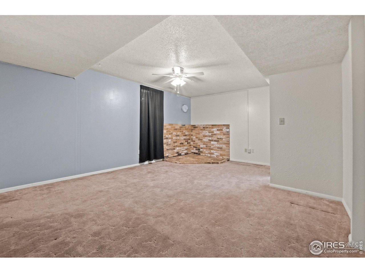 310 Apache Street Fort Morgan, CO 80701 - Photo 37 of 50 a view of a big room with carpet