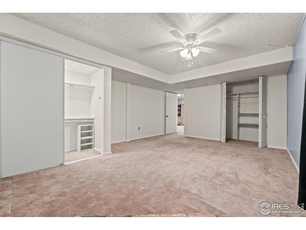 310 Apache Street Fort Morgan, CO 80701 - Photo 38 of 50 a view of an empty room with a ceiling fan