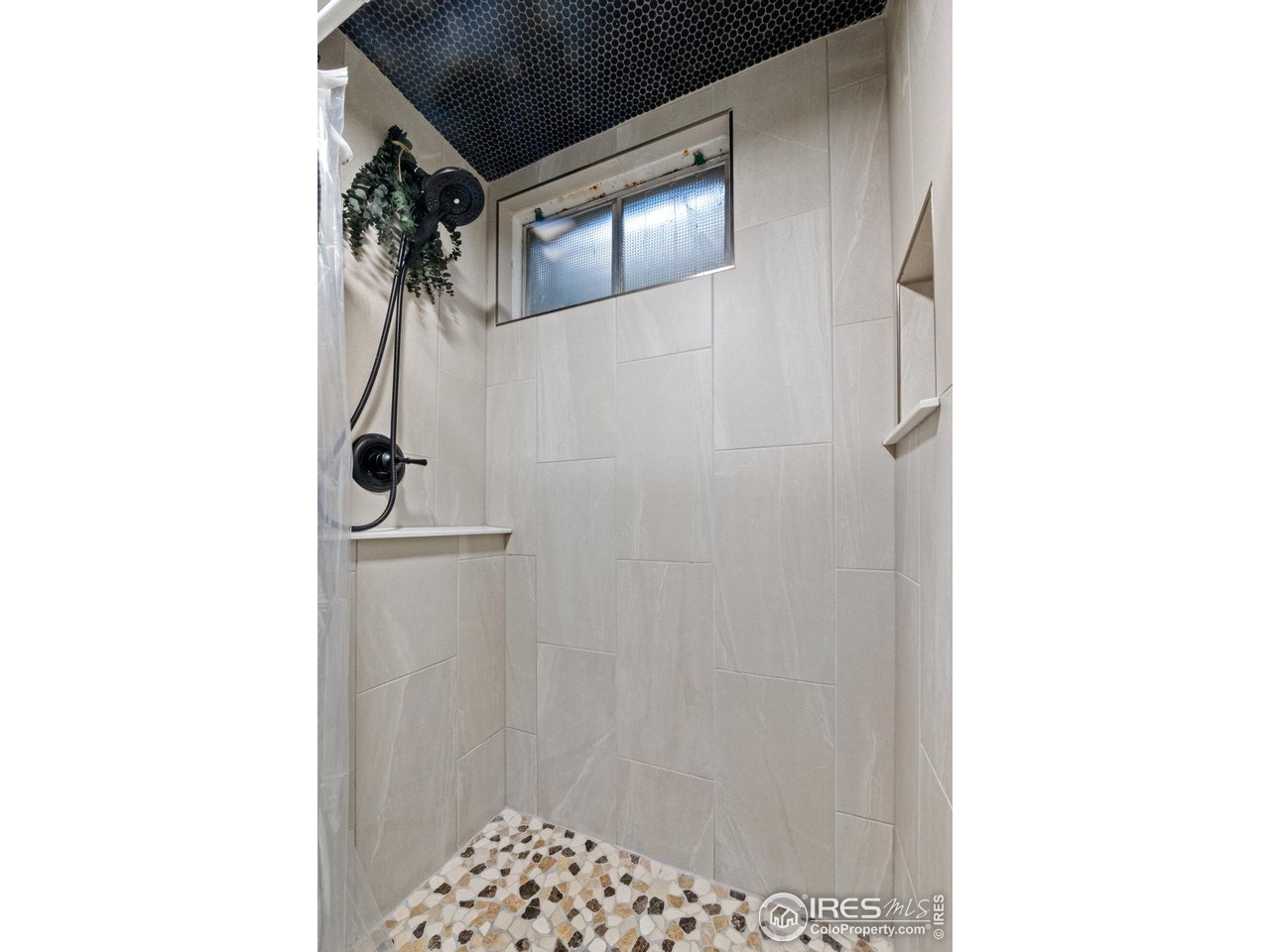 310 Apache Street Fort Morgan, CO 80701 - Photo 40 of 50 a bathroom with a shower and a sink