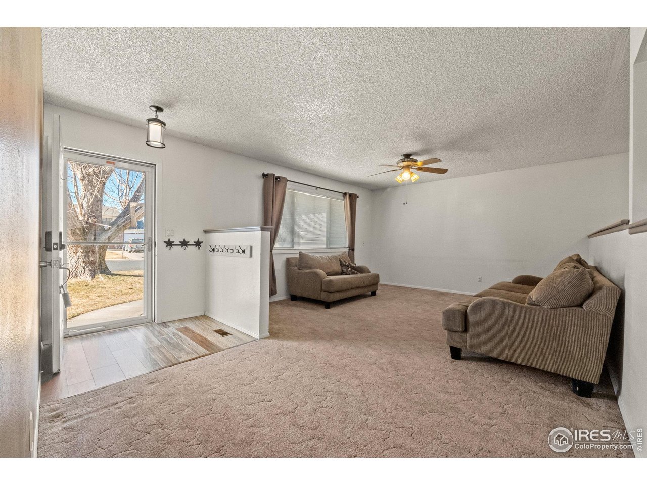 310 Apache Street Fort Morgan, CO 80701 - Photo 4 of 50 a living room with furniture and a window