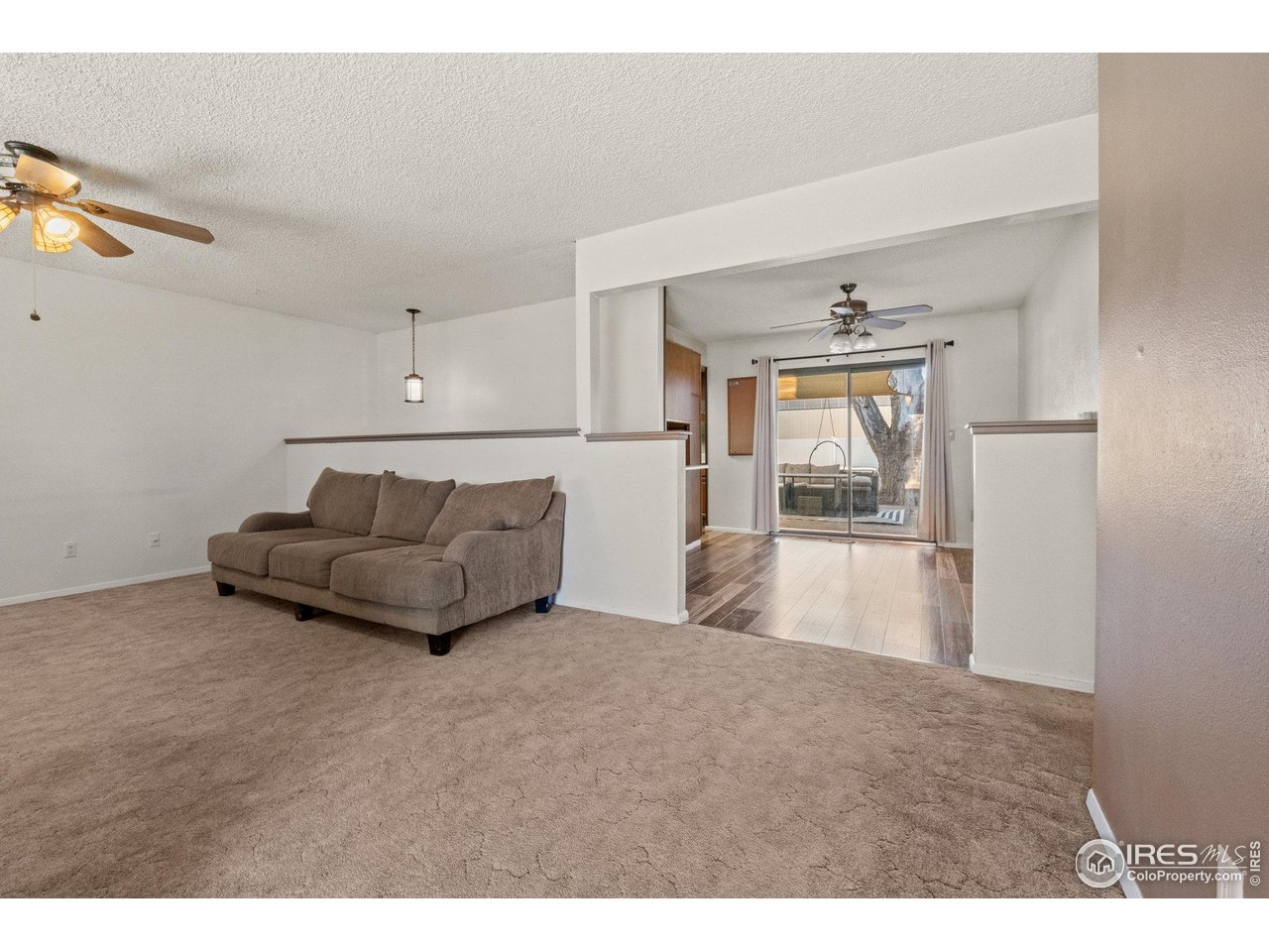 310 Apache Street Fort Morgan, CO 80701 - Photo 7 of 50 a living room with furniture and a window