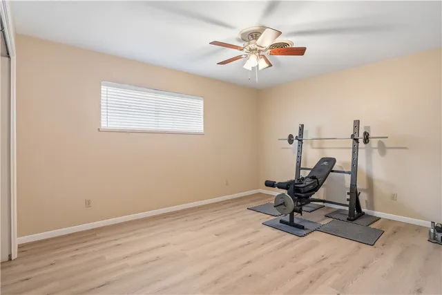 a view of a workspace with wooden floor