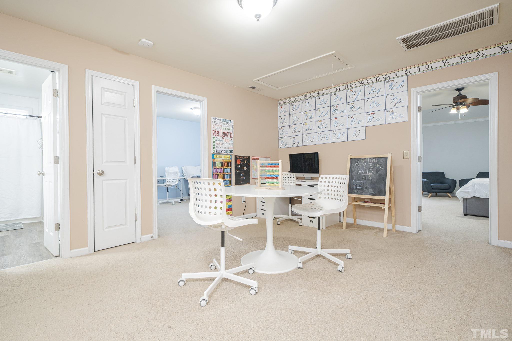 930 Pristine Lane Rolesville, NC 27571 - Photo 11 of 30 a view of a livingroom with table & chairs