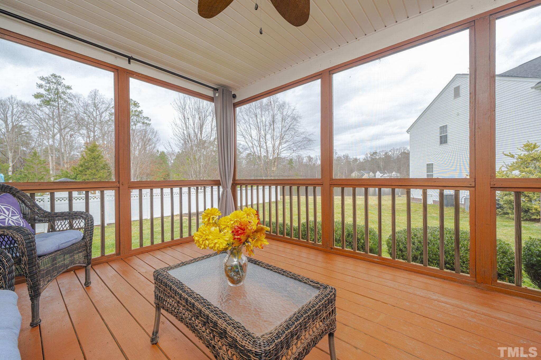 930 Pristine Lane Rolesville, NC 27571 - Photo 19 of 30 a view of a porch with furniture and wooden floor