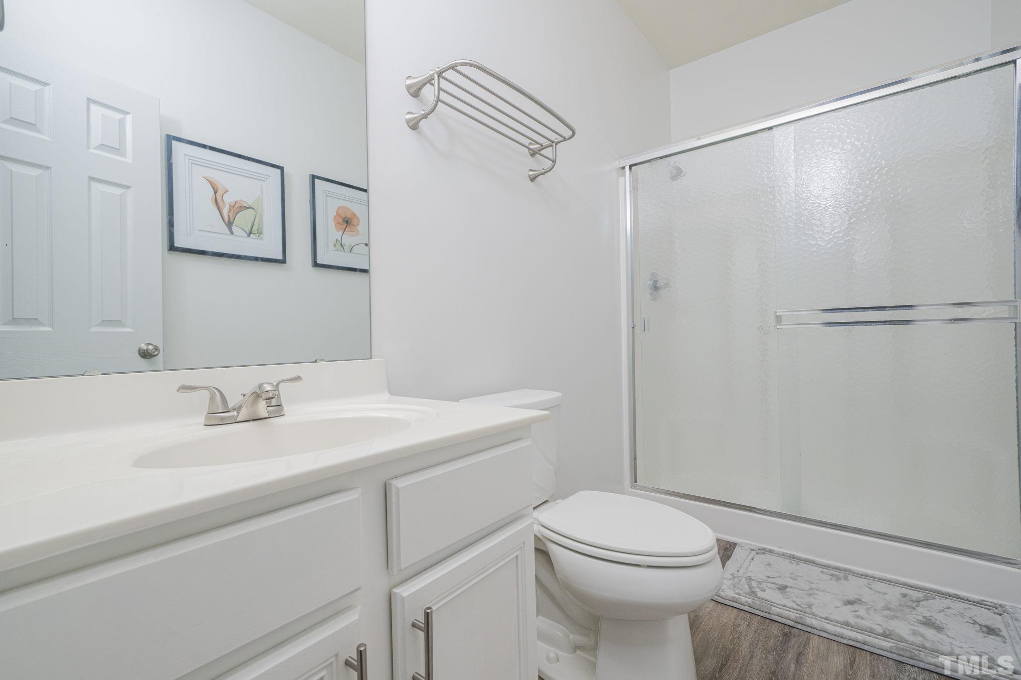 930 Pristine Lane Rolesville, NC 27571 - Photo 20 of 30 a bathroom with a sink a toilet and shower