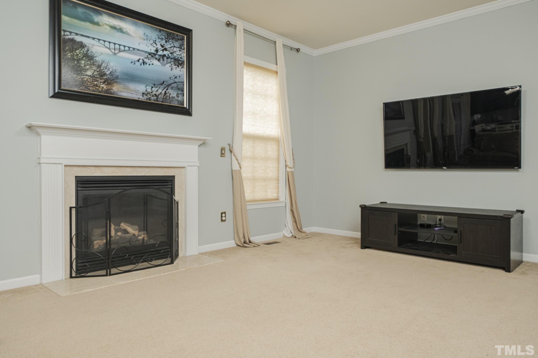 930 Pristine Lane Rolesville, NC 27571 - Photo 22 of 30 a living room with furniture and a fireplace