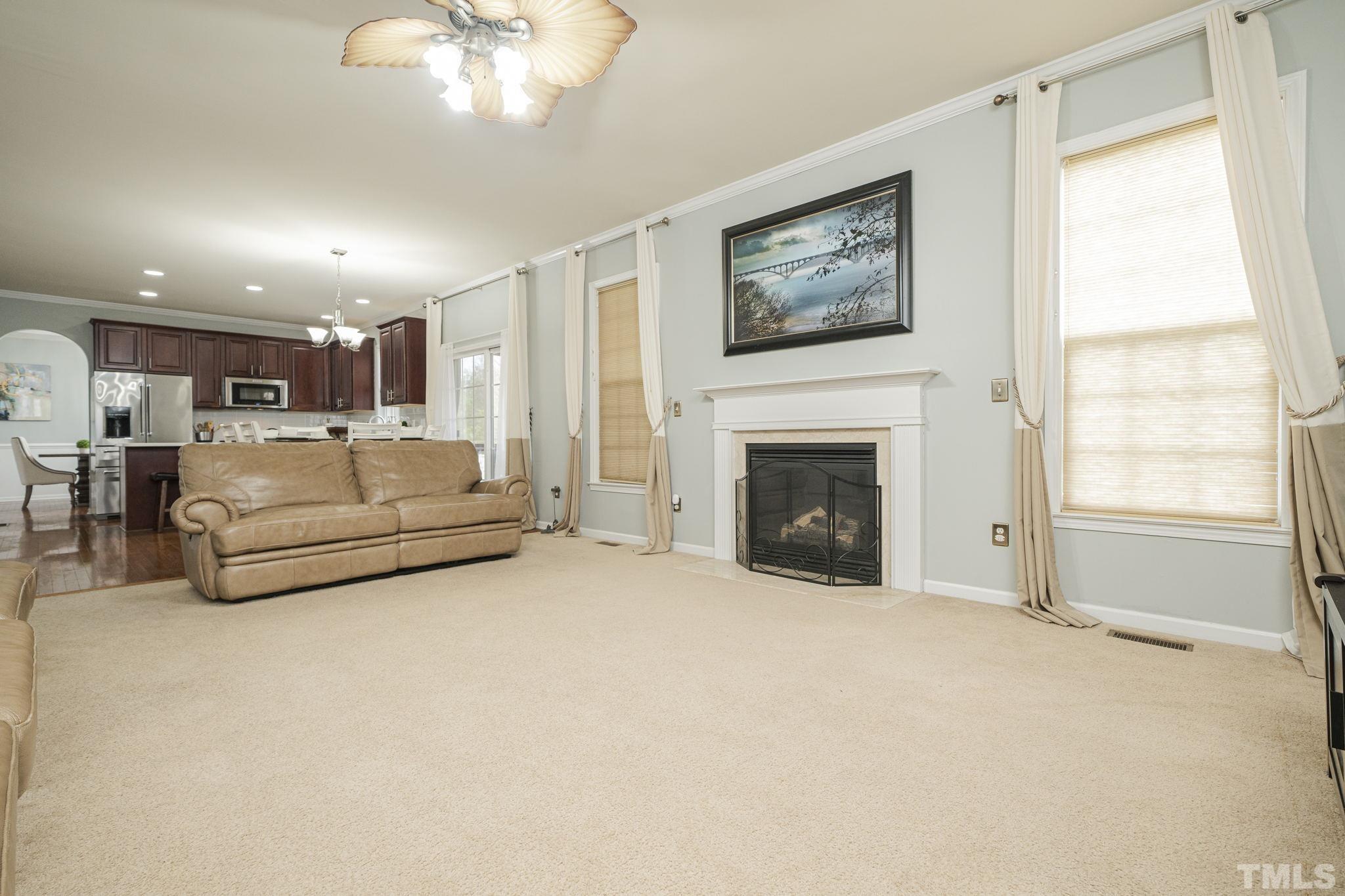 930 Pristine Lane Rolesville, NC 27571 - Photo 23 of 30 a living room with furniture and a fireplace