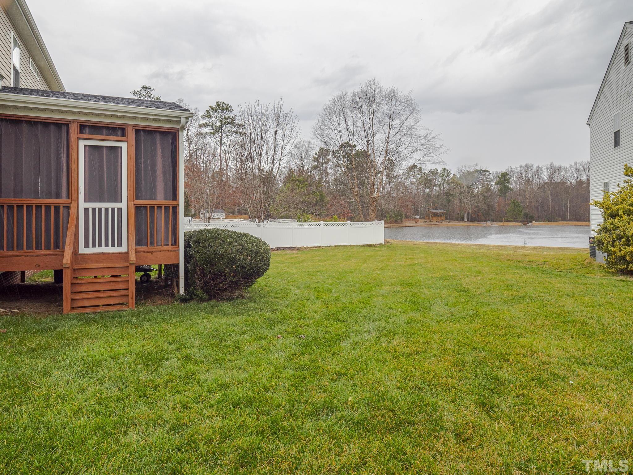 930 Pristine Lane Rolesville, NC 27571 - Photo 24 of 30 a view of a house with backyard and porch