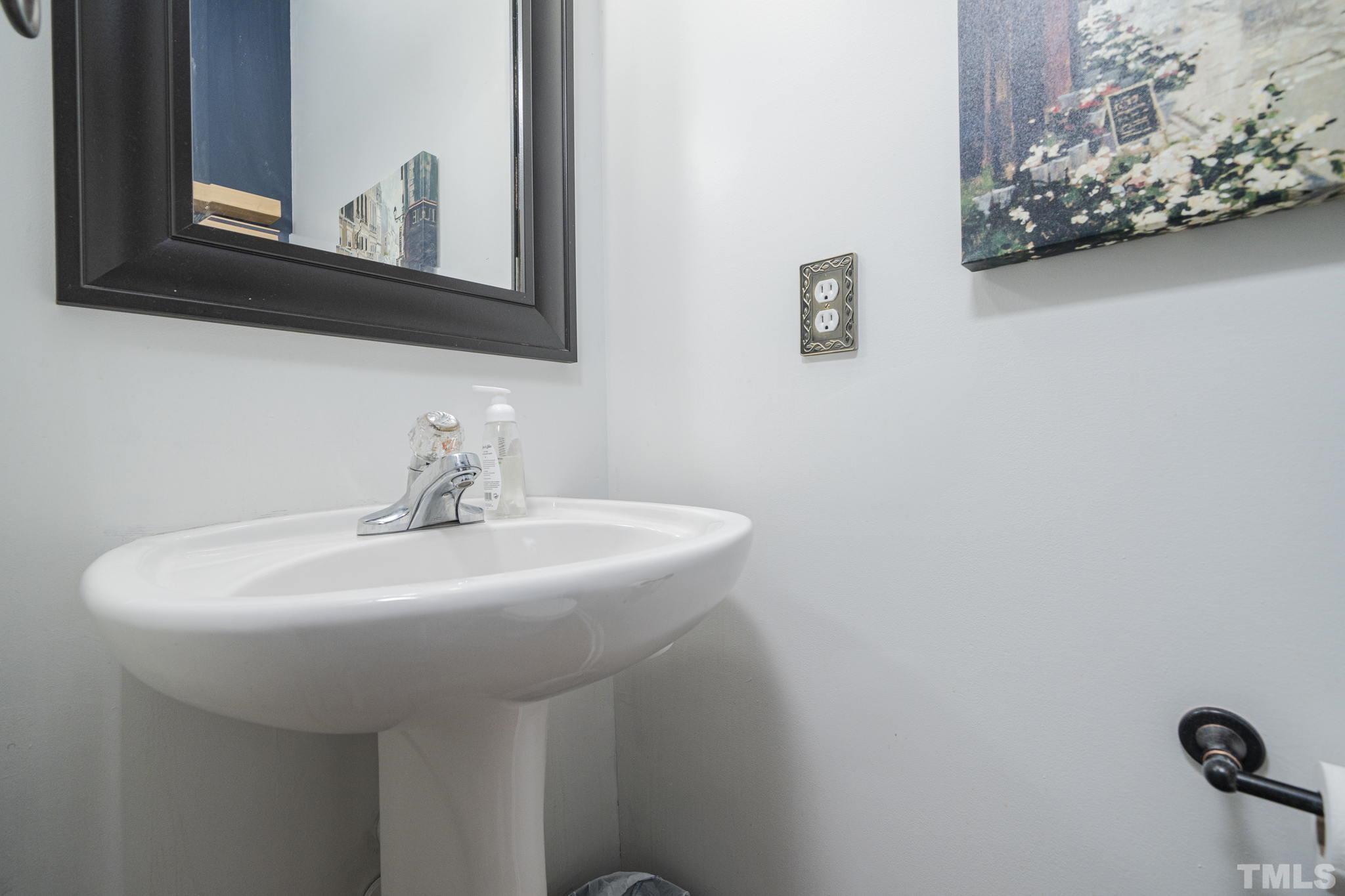 930 Pristine Lane Rolesville, NC 27571 - Photo 29 of 30 a bathroom with a sink and a mirror