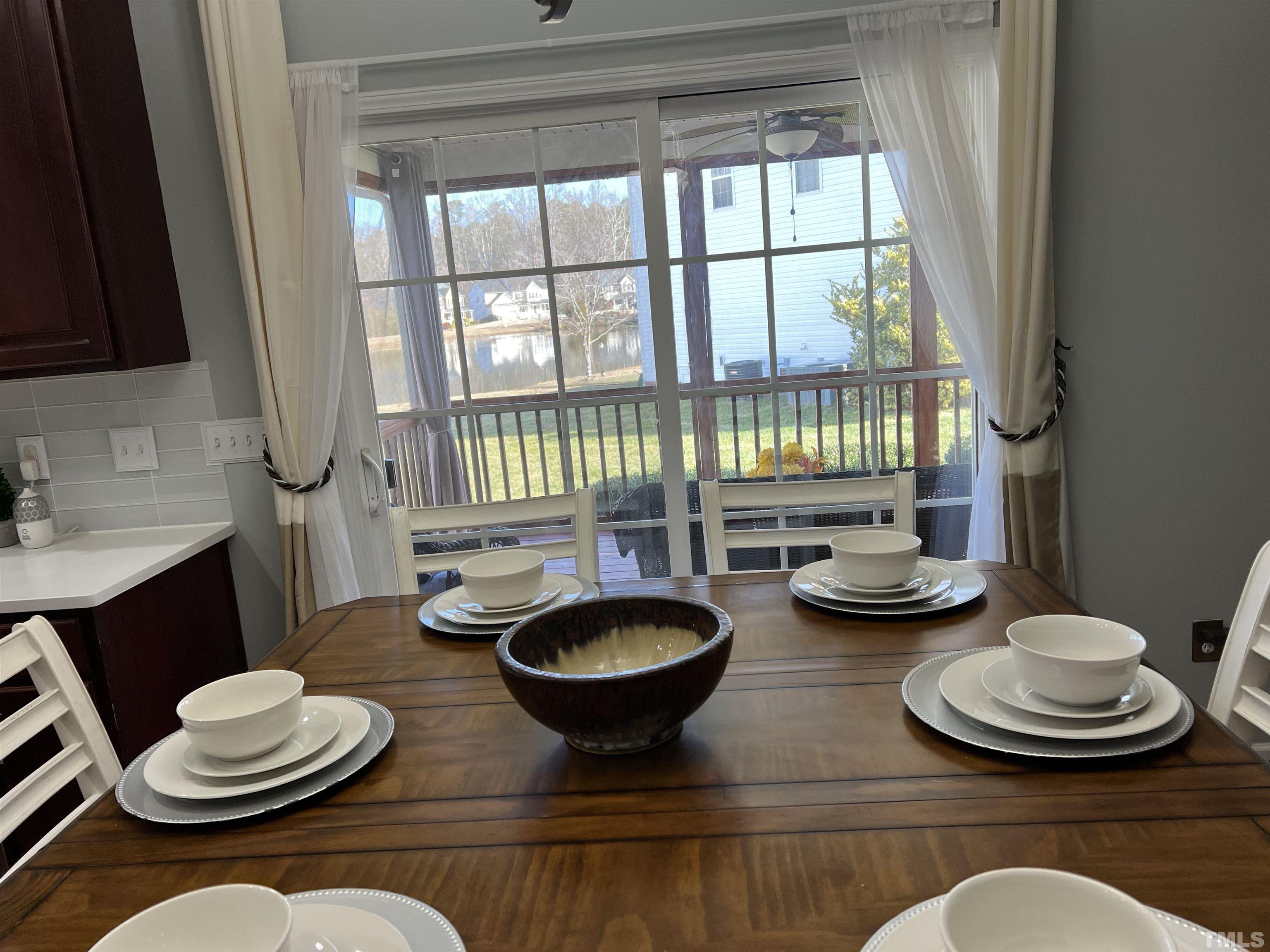 930 Pristine Lane Rolesville, NC 27571 - Photo 6 of 30 a table and chairs in a room