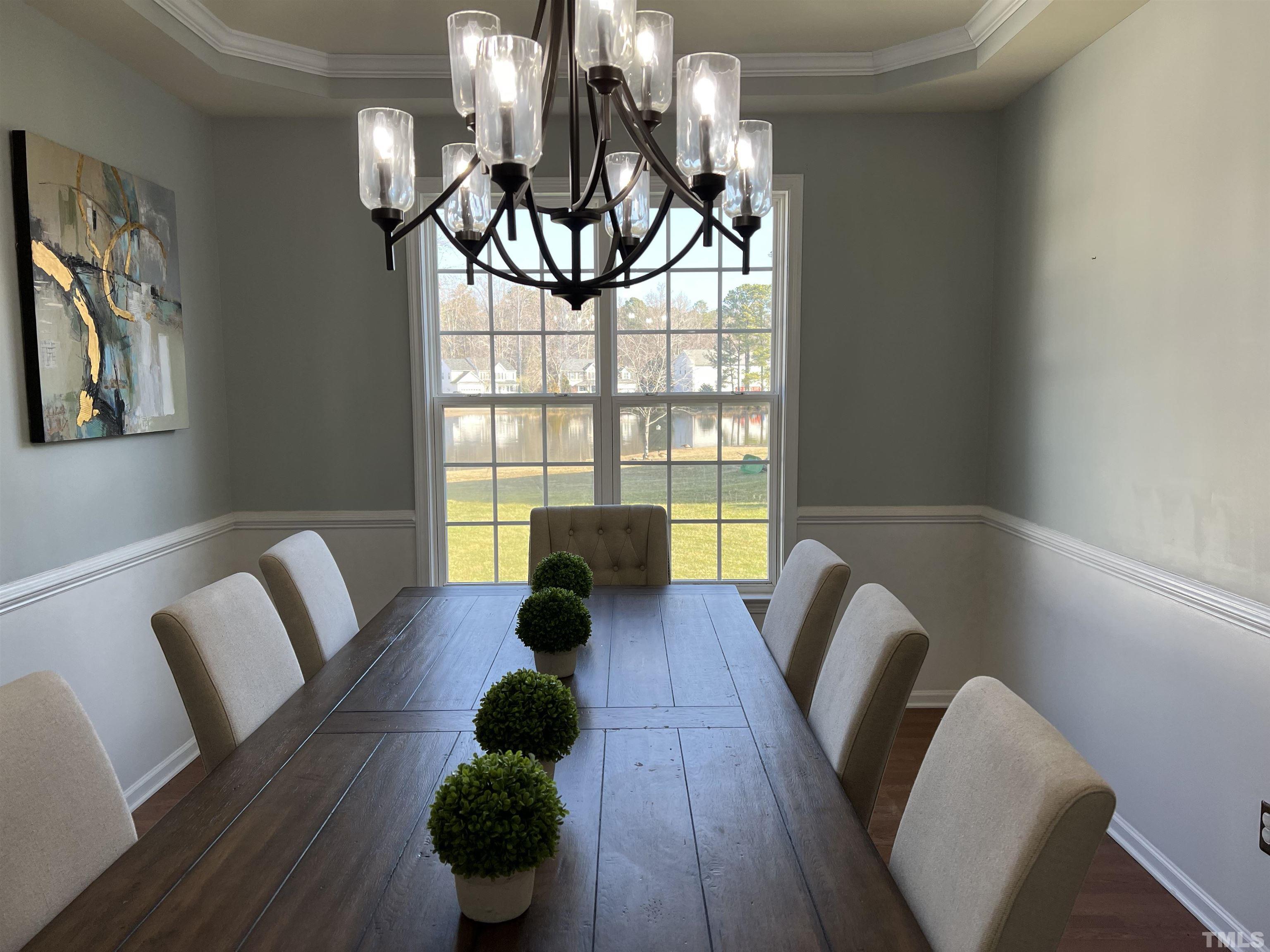 930 Pristine Lane Rolesville, NC 27571 - Photo 7 of 30 a living room with furniture and a chandelier