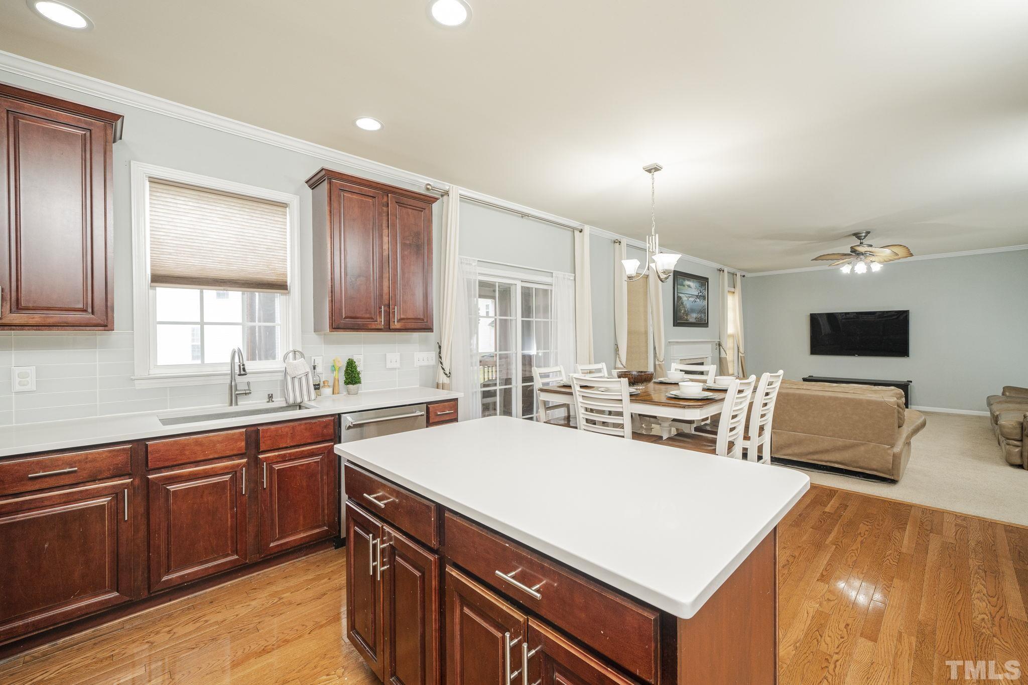 930 Pristine Lane Rolesville, NC 27571 - Photo 8 of 30 a view of a kitchen counter top space sink stainless steel appliances and cabinets