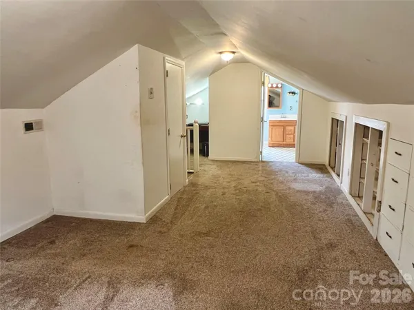 a view of hallway with livingroom