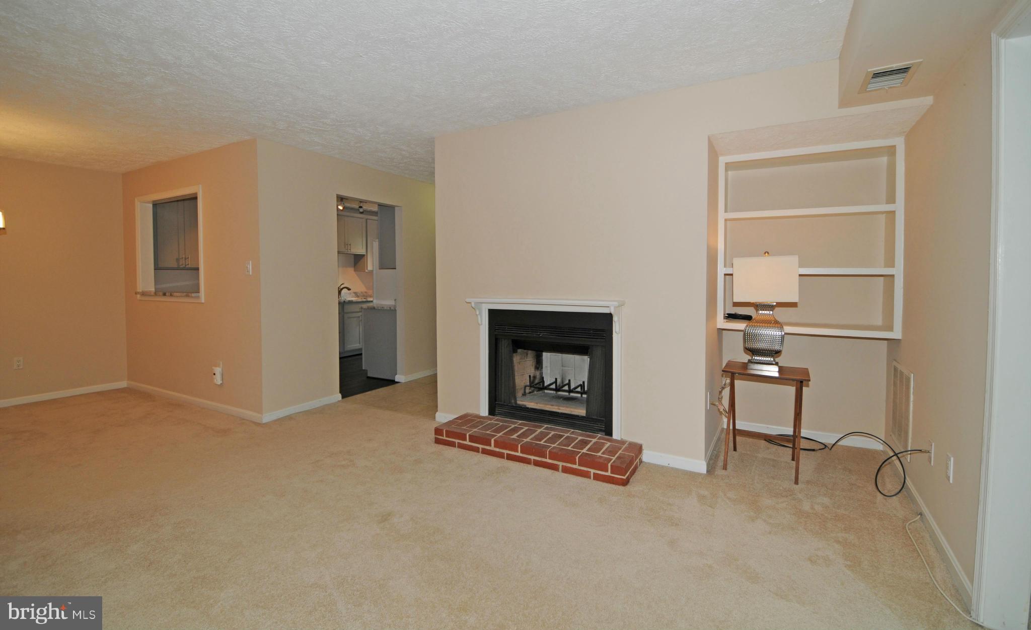 10125 Oakton Terrace Road, Unit 10125 Oakton, VA 22124 - Photo 11 of 30 BUILT-INS TO THE RIGHT OF THE FIREPLACE