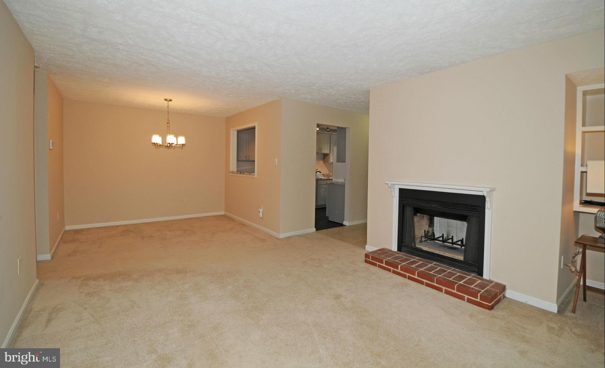 10125 Oakton Terrace Road, Unit 10125 Oakton, VA 22124 - Photo 12 of 30 LIVING ROOM LOOKING TOWARD DINING AREA